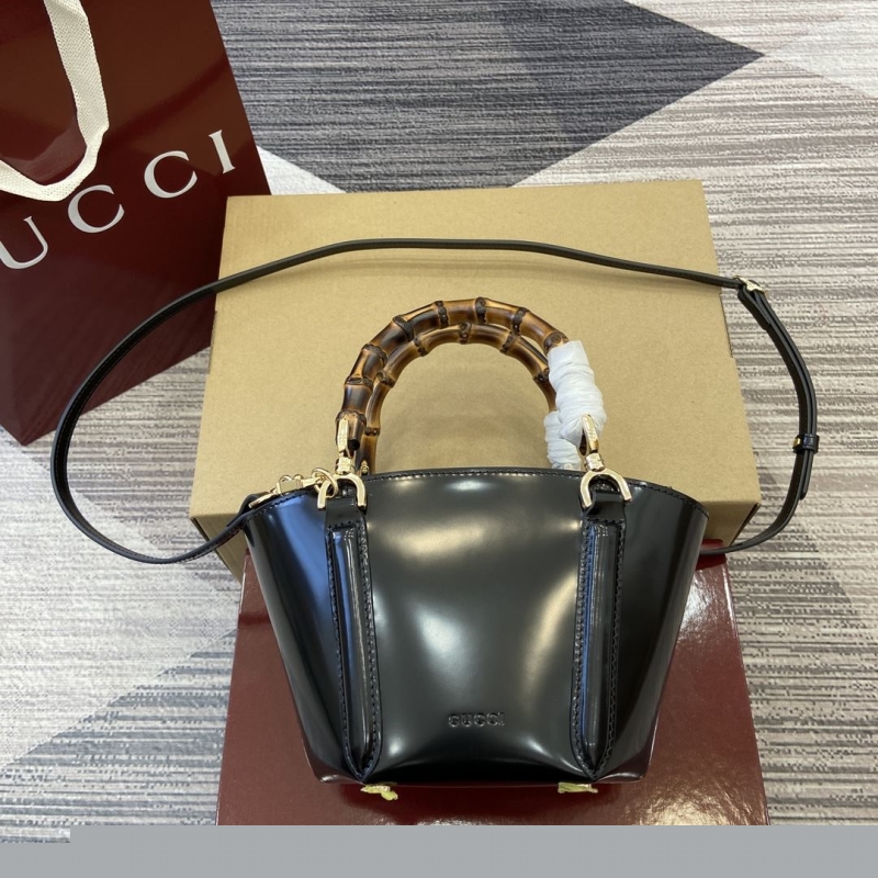 G*u*i top handle bags